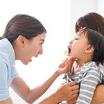 dentist examining a child’s mouth